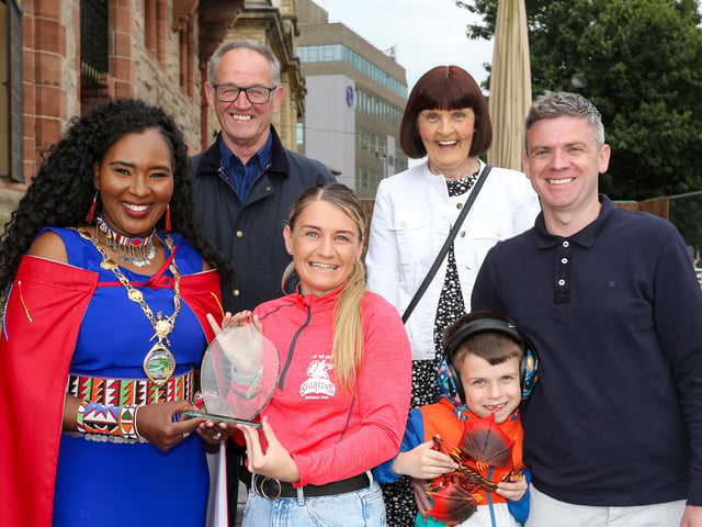 The Mayor of Derry Councillor Lilian Seenoi Barr presenting a civic gift to Gemma Thompson, City of Derry Spartans Athletic Club, at in reception in the Guildhall following her recent success in winning 2 medals at the European Masters Indoor Championships in Poland. Gemma won the medals in the 200m and 60m setting an Irish Record. Included are Gemma’s husband Eoghan Tucker and son Shane (7), and her parents Davy and Patricia Thompson.Photo Lorcan Doherty