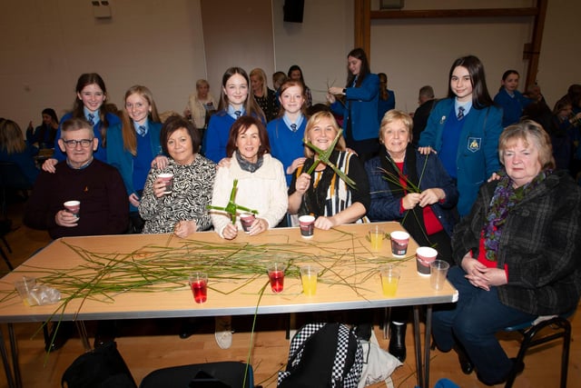 Pupils and grandparents pictured with some of the St. Brigid’s crosses they made during Wednesday’s event.