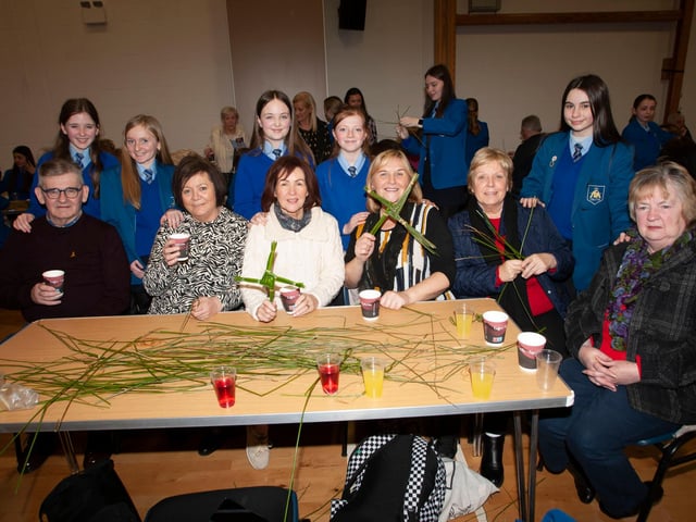 Pupils and grandparents pictured with some of the St. Brigid’s crosses they made during Wednesday’s event.