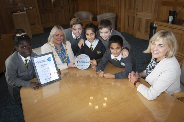 SCHOOL OF SANCTUARY. . . . . . .The Mayor of Derry City and Strabane District Council, Sandra Duffy pictured with Mrs. Michelle Ramsey and pupils from the Model Primary School who recently were awarded the Learn Action Share ‘School of Sanctuary’. The children spent time with the Mayor in her parlour, asking questions and getting to try on her ‘Chain of Office.’ Included are Maame, Nathan, Sara, John and Samarsh.. (Photos: Jim McCafferty Photography)