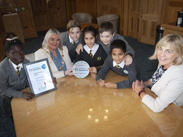SCHOOL OF SANCTUARY. . . . . . .The Mayor of Derry City and Strabane District Council, Sandra Duffy pictured with Mrs. Michelle Ramsey and pupils from the Model Primary School who recently were awarded the Learn Action Share ‘School of Sanctuary’. The children spent time with the Mayor in her parlour, asking questions and getting to try on her ‘Chain of Office.’ Included are Maame, Nathan, Sara, John and Samarsh.. (Photos: Jim McCafferty Photography)