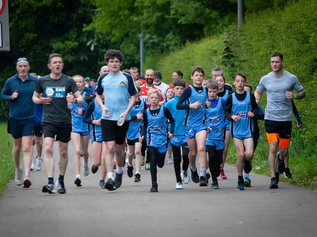Runners from Hollybush PS cross country team lead the way down Culmore Road  in Friday’s School Run Challenge. (Photos: Jim McCafferty Photography)