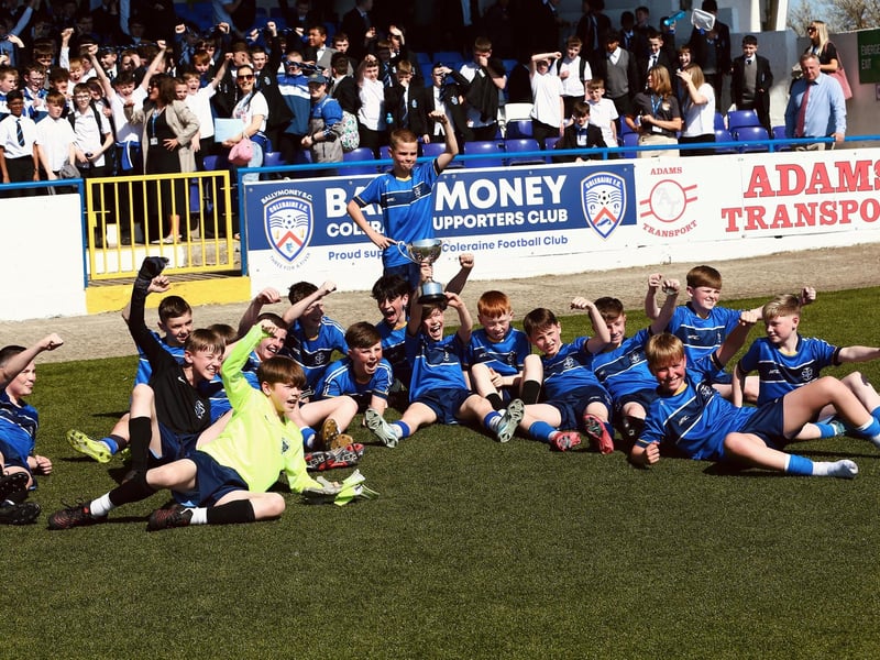 St Columb's College U12s celebrate with the NI Schools Cup in front of their large support.