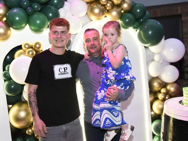 Daniel with his godfather Mickey and Erin