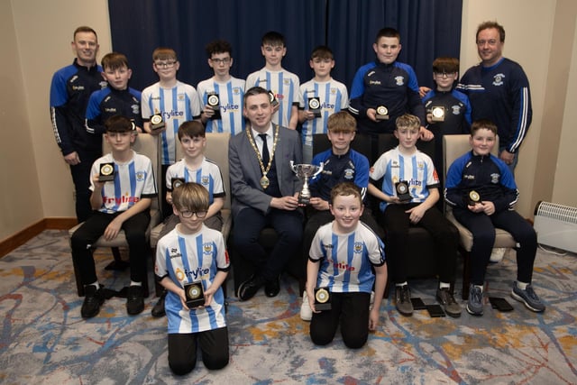 The Deputy Mayor, Jason Barr presenting Strabane Athletic FC 2012s with the Summer Cup at the D&D Youth Awards at the City Hotel on Friday night last. Included are coaches Martin McDaid and Shaun Molloy.