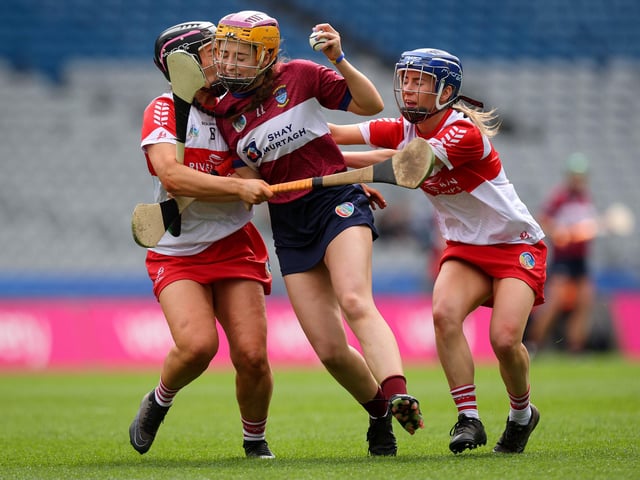 Derry’s Niamh Quinn and Dervela O’Kane with Caoimhe McCrossan of Westmeath during Sunday's Very Camogie League Division 2A Final in Croke Park. (Photo: INPHO/Ryan Byrne).