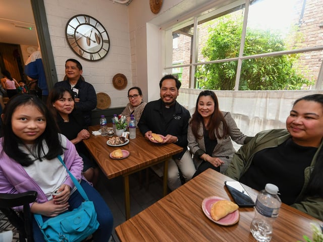 Fr Milo pictured with guests at the opening of Derry’s first Filipino restaurant, called Bahay Kusina, in the Craft Village, on Saturday afternoon. Photo: George Sweeney