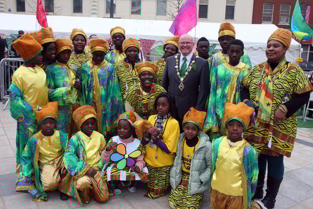 The Mayor of Derry Councillor Kevin Campbell, pictured with members of the Ghana Union dance group from Letterkenny, on his tour of Waterloo Place during the St. Patrick’s Day celebrations on Sunday.