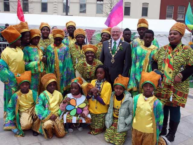 The Mayor of Derry Councillor Kevin Campbell,  pictured with members of the Ghana Union dance group from Letterkenny, on his tour of Waterloo Place during the St. Patrick’s Day celebrations on Sunday.