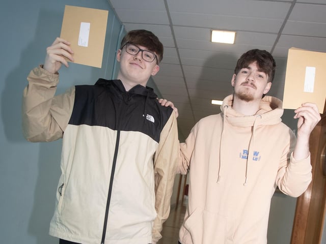 Tiernan McElhinney and Pierce Green with their A Level results at St. Joseph's on Thursday.