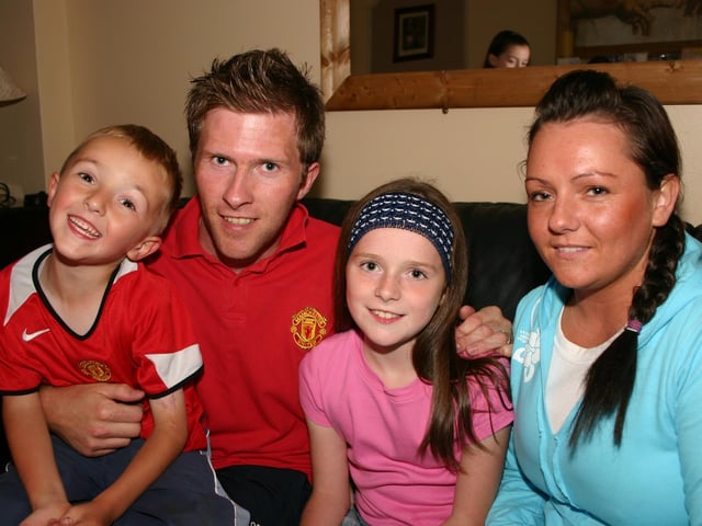 Jade McClafferty with brother Ciarsha dad Shimmy and mum Elaine. 7467dd : Parties in Derry in July 2005.