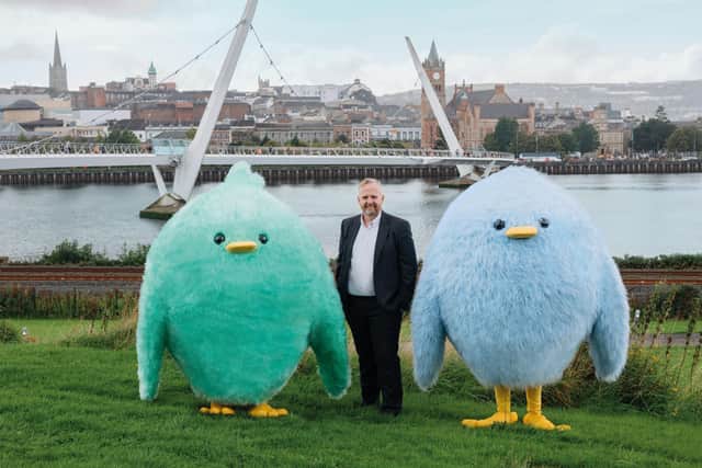 Damian Wilson and mascots from Share Energy.