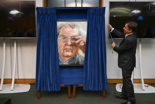 John Hume Jnr. unveils the official portrait his father, Nobel Prize winner John Hume in the House of Commons. ©UK Parliament/Jessica Taylor