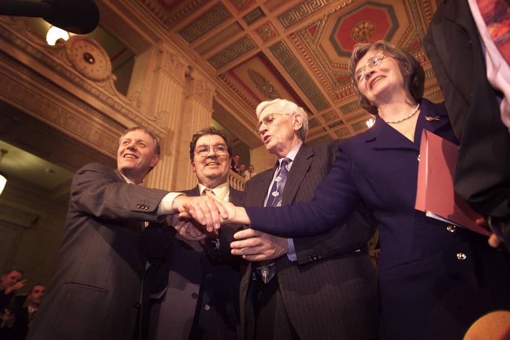 The SDLP team celebrating at Stormont after Cabinet positions were agreed in November 1999. From left to right, Sean Farren, John Hume, Seamus Mallon and Bríd Rodgers. (Photo by Peter Macdiarmid/Getty Images)