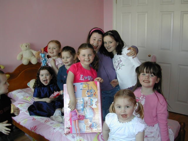 Niamh McDevitt (centre) with family and friends on her fifth birthday.