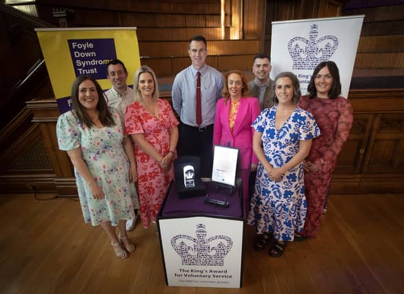 Christopher Cooper, manager, Foyle Down Syndrome Trust pictured with his staff at last week's King Award for Voluntary Service event in the Guildhall, Derry. photo by Jim McCafferty Photography