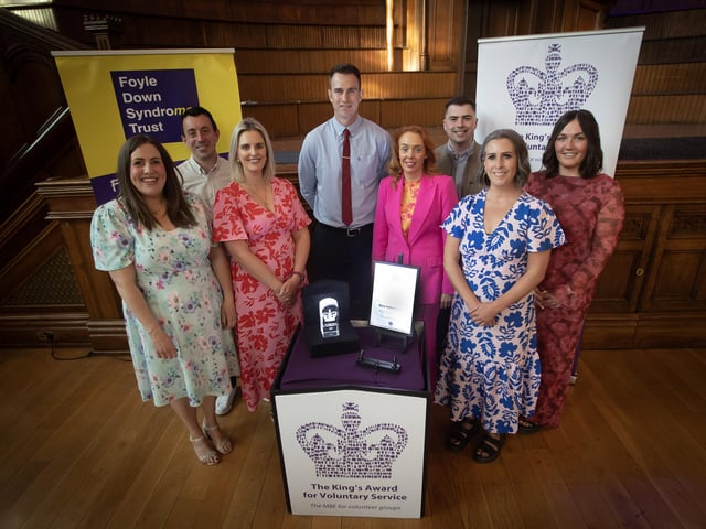 Christopher Cooper, manager, Foyle Down Syndrome Trust pictured with his staff at last week's King Award for Voluntary Service event in the Guildhall, Derry. photo by Jim McCafferty Photography