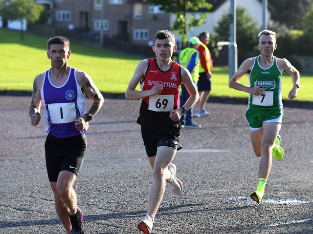 Foyle Valley's Matthew McLaughlin (1), Spartans Aidan Healy (69) and Mark Tourish (7) Rise Running Club. Photo: George Sweeney