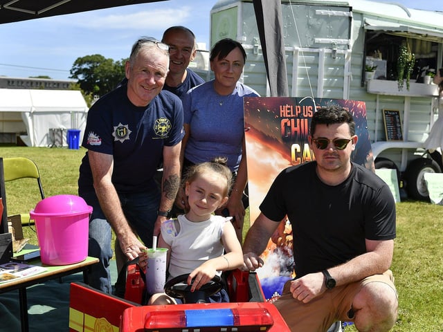 Locals Carla and Geraldine pictured with Buncrana Fire Fighters Mickey Donaghay, Euan Doherty and Cathal Doherty during the Kids Fest held at the Shore Front in association with the Buncrana Music Festival. Photo: George Sweeney
