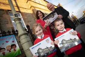 ST. EUGENE'S 2025 SOUVENIR CALENDAR ON SALE!. . . . .The Bishop of Derry, Dr. Donal McKeown pictured together with Mrs. Carol Duffy, Principal, St. Eugene's Primary School and two P1 pupils on Monday morning to promote the 2025 Souvenir Calendar celebrating the school's 170th Anniversary. The full colour glossy calendar is choc-a-bloc with photos of the schoolchildren from nursery up to P7 and also highlights some of the activities taking place throughout the school year. Priced at £10 it will make a fantastic Christmas present. Anyone looking to buy a copy is asked to contact the school on 02871 261601.