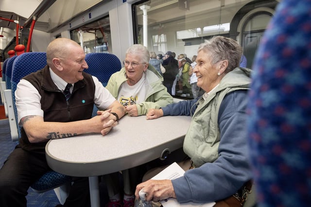 All smiles aboard the Chat Tea Train Chatty Carriage