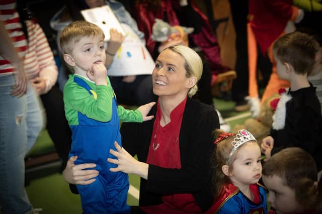 Miss Ciara Hegarty and young Roan excited by all the colourful costumes celebrating World Book Day at Greenhaw Primary School.