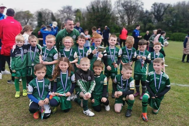 Foyle Harps celebrate their Gerry Magee Cup success.