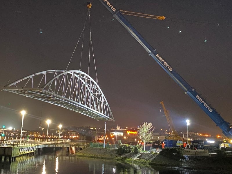 The Pennyburn foot and cycle bridge was officially set in place by contractor, FP McCann Ltd, last night. This is a key stage in the project which will see the the bridge and greenway link to Bay Road Park open to the public later in the Spring. The project is funded by the INTERREG VA Programme, administered by the Special EU Programmes Body and the Department for Communities.