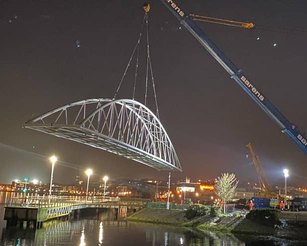 The Pennyburn foot and cycle bridge was officially set in place by contractor, FP McCann Ltd, last night. This is a key stage in the project which will see the the bridge and greenway link to Bay Road Park open to the public later in the Spring. The project is funded by the INTERREG VA Programme, administered by the Special EU Programmes Body and the Department for Communities.