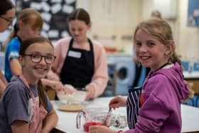 Smiling girls at a recent Spraoi agus Sport baking event.