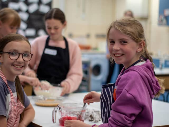 Smiling girls at a recent Spraoi agus Sport baking event.