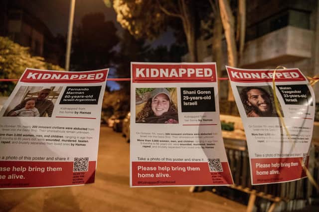 10/24/2023, Photos of some who have been kidnapped at a demonstration in front of the President House in Jerusalem, Israel. (Photo by Yahel Gazit / Middle East Images / Middle East Images via AFP)