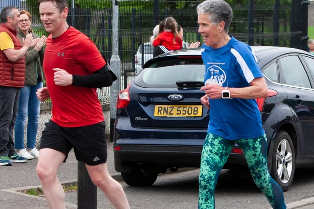 Legendary local runner and netball coach Roisin Lynch still manages to share a joke after completing 5km on Friday. On left is Hollybush governor Denis O’Donnell. (Photos: Jim McCafferty Photography)