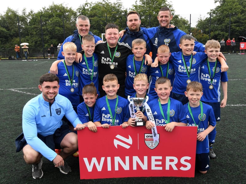 O'Neills staff member Charlie White pictured with the Shankill Juniors team which lifted the O'Neills Foyle Cup Under-11's title at Bishop's Field on Friday.