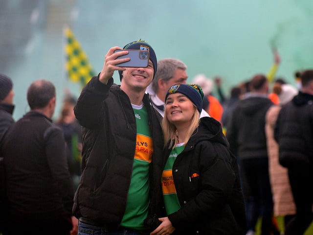 Fans of Watty Graham’s, Glen, take a selfie against the celebrations of their club’s SFC final victory over Slaughtneil in Celtic Park, on Sunday afternoon. DER2243GS – 019