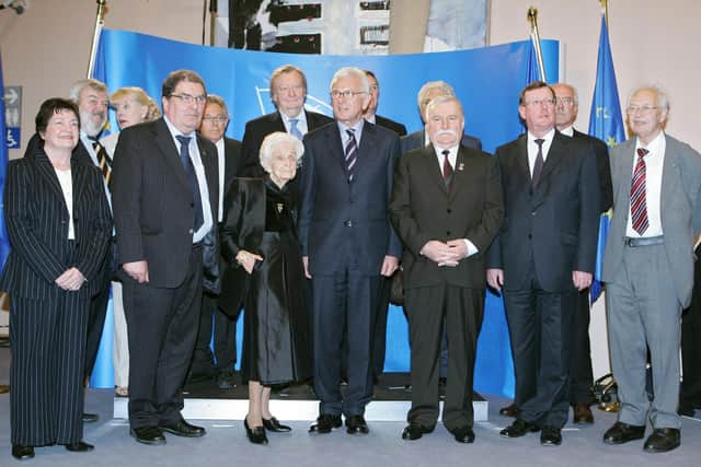 John Hume with the President of the European Parliament Hans-Gert Poettering and Representatives of European Nobel-Prize laureates first row (L-R) Betty Williams Laureate of Peace, Rita Levi-Montalcini Laureate of Medicine 1996, Lech Walesa Peace Prize in 1983, Paul Crutzen Chemistry Prize in 1995, Rheinard Selten Economy Prize in 1994, Jack Steinberge Economy Prize in 1994; and second Row (L-R): Martinus Veltman Physics Prize in 1999, Mairead Corrigan Peace Prize, Carlos Rubbia Physics in 1984, during the commemorative ceremony of the 50th anniversary of the Rome Treaties at the European Parliament in at the EU Parliament in Brussels. AFP PHOTO JOHN THYS (Photo credit should read JOHN THYS/AFP via Getty Images)