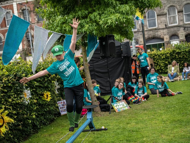 A young tightwire walker entertaining the crowds