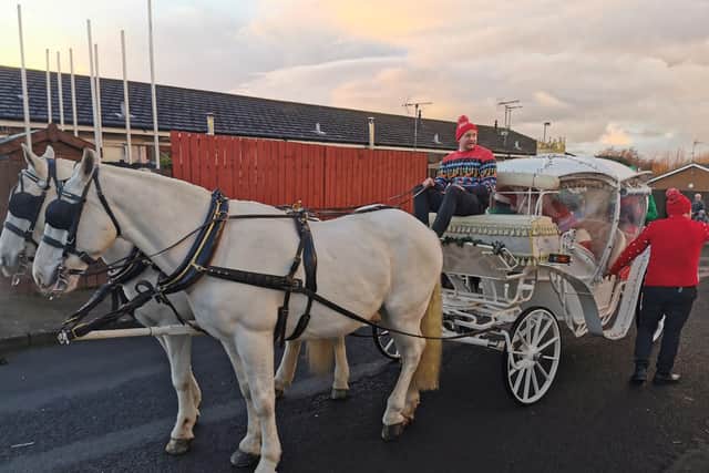Santa and his horses arrive in style at the Caw & Nelson Drive Santa’s grotto.