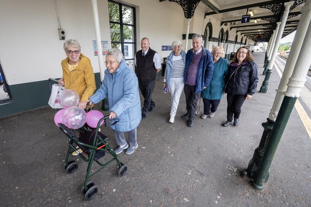 Passengers get ready to hop on board the Chat Tea Train Chatty Carriage