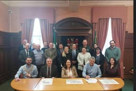 Pictured in the signing of the Contract for the Baile Na Carraige Phase 2 are:   Front Row L-R; Cllr. Jack Murray Cathaoirleach Inishowen MD, Liam Ward Director of Community Development & Planning Services (DCC), Cllr. Niamh Kennedy Cathaoirleach (DCC), Shay McCallion (McCallion Construction Limited), Lisa McBay (McCallion Construction Limited).    Back Row L-R; John Gallagher A/Senior Engineer (DCC), Patsy Lafferty Director of Housing Corporate and Cultural Services (DCC), Jim Boner Senior Executive Engineer (DCC), Cllr. Martin Farren, Nigel McGlynn Executive Architectural Technician (DCC), Cllr. Terry Crossan, Cllr. Albert Doherty, Tara Quinn Executive Architect (DCC), Cllr Fionán Bradley, Cllr Joy Beard, Cllr. Ali Farren, Claire Burke Senior Executive Architect (DCC), Una Creswell A/Area Manager (DCC), Gearoid Doherty Executive Engineer (DCC).