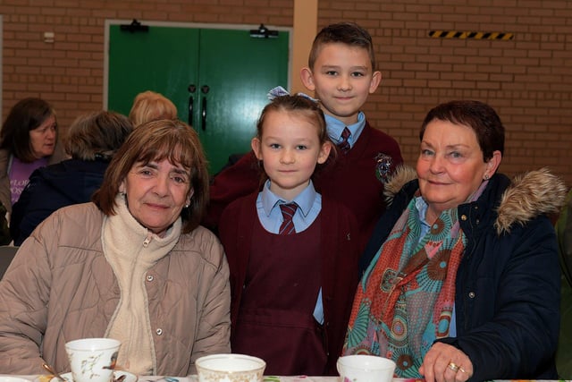 Joan Holden and Bríd Carlin with Dayna and AJ at St John’s PS Grandparents Vintage Tea. Photo: George Sweeney
