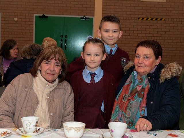 Joan Holden and Bríd Carlin with Dayna and AJ at St John’s PS Grandparents Vintage Tea. Photo: George Sweeney
