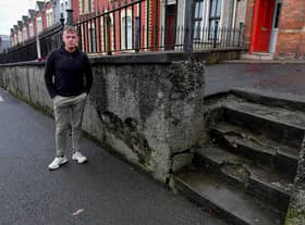 Sinn Féin MLA Padraig Delargy pictured beside dilapidated steps leading to homes in Stewart’s Terrace and Keer’s Terrace on Creggan Road. Photo: George Sweeney. DER2311GS – 20