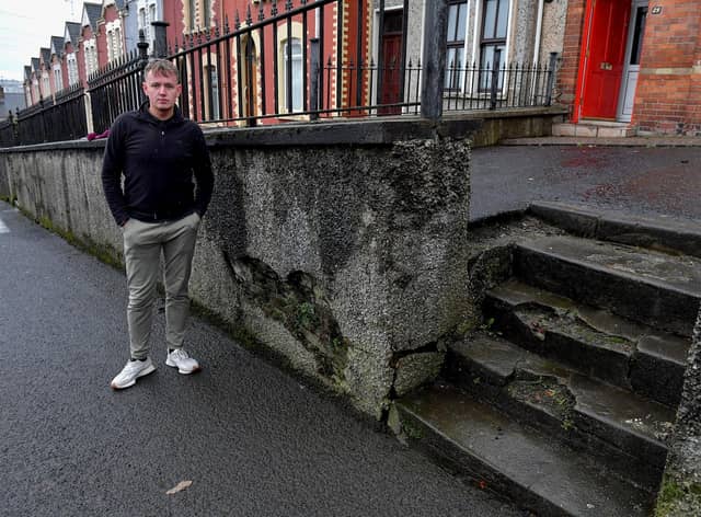 Sinn Féin MLA Padraig Delargy pictured beside dilapidated steps leading to homes in Stewart’s Terrace and Keer’s Terrace on Creggan Road. Photo: George Sweeney. DER2311GS – 20