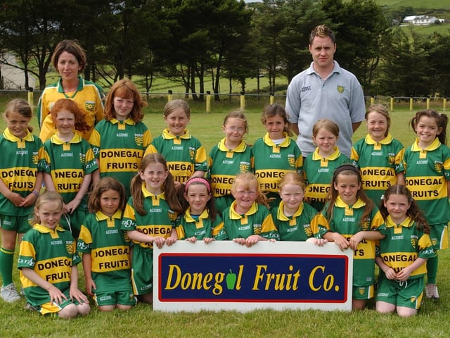 Members of the U-8 girls team taking part in the Malin GAA Summer Camp at Glengad.Included, are Maria McLaughlin, coach, and Eamon Redden, County player. (2007A04)