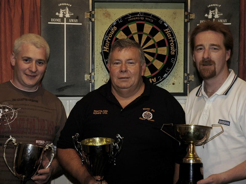 Members of Mary B`s Darts team pictured celebrating their end of season party, from left Sean Brown, John Mc Closkey and Martin Mc Closkey.
