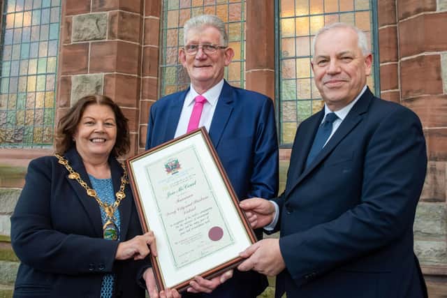 Derry City and Strabane District Council Mayor, Councillor Patricia Logue and Chief Executive John Kelpie with Jon McCourt who has been awarded the freedom of Derry City and Strabane following a ceremony in The Guildhall. Jon has campaigned tirelessly for the victims of Institutional abuse. Picture Martin McKeown. 19.12.23