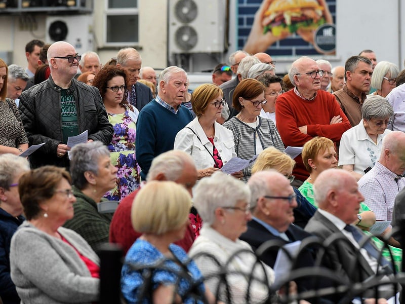 People gather for a service in Claudy marking the 52nd anniversary of the car bombings that killed nine people and injured 30 others. Photo: George Sweeney