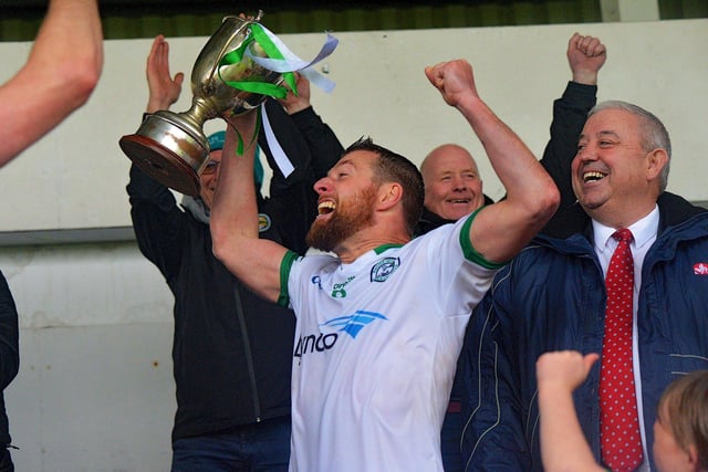 Craigbane captain Brian Rainey lifts the Derry Junior Championship trophy after their win over Ballerin in Celtic Park on Sunday afternoon last. Photo: George Sweeney.  DER2241GS – 39