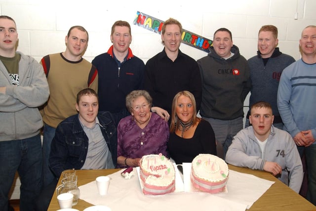 Phoebe  Doherty with nine of her grandsons and her only granddaugther in Derry at her 90th birthday party. Included are, Paul, Kevin, David, Joesph, Sean, Brian, Kieran, Christopher, Niell and Carolanne. (2502CG12)                             